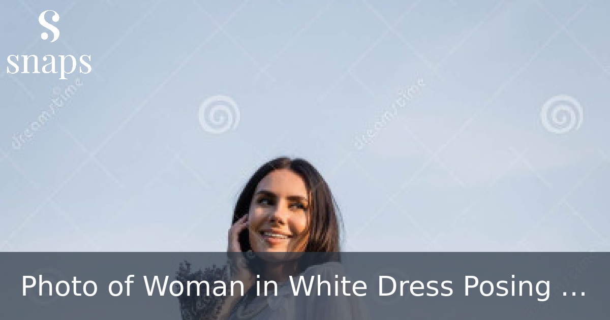 Photo of Woman in White Dress Posing with Her Head up and Her Hands ...